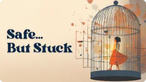 Editorial illustration of a woman in an orange dress standing inside an open birdcage, glowing with warm amber light from within, against a soft cream background with rust and orange paint splashes scattered around the cage. Text reads: "Safe... But Stuck."